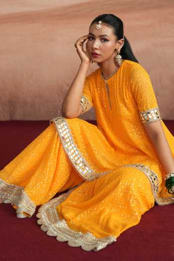 Mustard Moon By Neyha And Vrinda_Yellow Georgette Round Neck Mishka Flared Short Kurta Sharara Set _at_Aza_Fashions