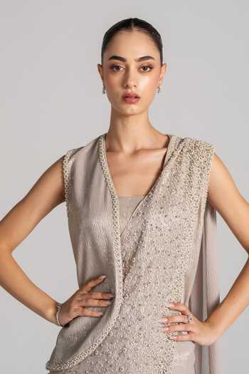 Namrata Joshipura Ivory Open Neck, Shimmer Pleated Saree Set With Jacket at Aza Fashions Namrata Joshipura_Ivory Open Neck, Shimmer Pleated Saree Set With Jacket _at_Aza_Fashions