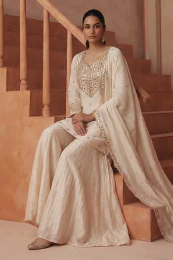 Shop Basanti Kapde Aur Koffee Ivory Chanderi, Organza, Satin Split V-neck, Yes Embroidered Kurta Sharara Set Online at Aza Fashions Shop_Basanti Kapde Aur Koffee_Ivory Chanderi, Organza, Satin Split V-neck, Yes Embroidered Kurta Sharara Set _Online_at_Aza_Fashions