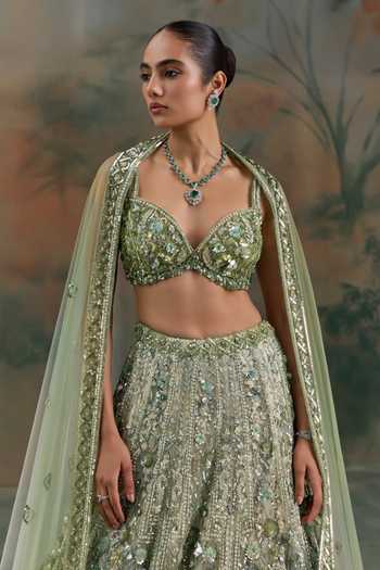 Opus Atelier Green Net Sweetheart Neck Sequin Embroidered Lehenga Set at Aza Fashions Opus Atelier_Green Net Sweetheart Neck Sequin Embroidered Lehenga Set _at_Aza_Fashions