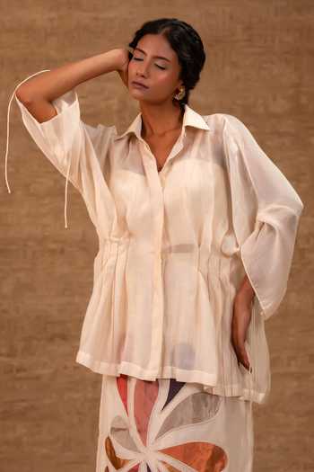 Eeda Ivory Silk, Tissue, Shantoon Collared Neck, Pleated Shirt And Applique Skirt Set at Aza Fashions Eeda_Ivory Silk, Tissue, Shantoon Collared Neck, Pleated Shirt And Applique Skirt Set _at_Aza_Fashions