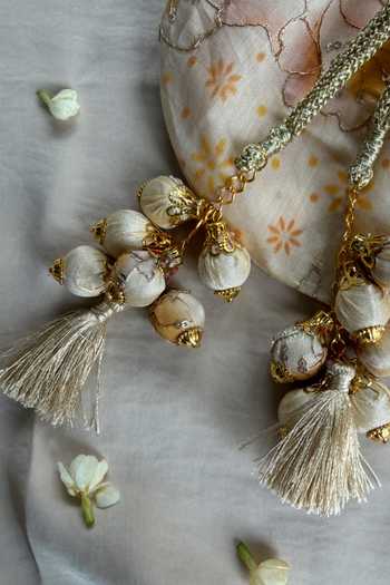 Quirky Tales Beige Embroidery, Mirrors, Tassels Floral Work Strap Potli Online at Aza Fashions Quirky Tales_Beige Embroidery, Mirrors, Tassels Floral Work Strap Potli _Online_at_Aza_Fashions