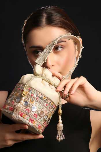 Shop Quirky Tales Beige Embroidery, Beads, Pearls, Mirrors, Tassels Multi Colour Bucket Potli Online at Aza Fashions Shop_Quirky Tales_Beige Embroidery, Beads, Pearls, Mirrors, Tassels Multi Colour Bucket Potli _Online_at_Aza_Fashions