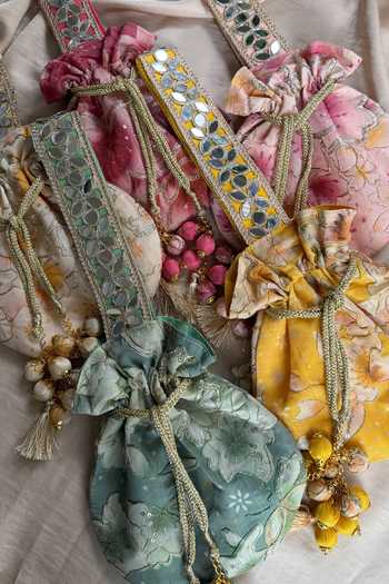 Shop_Quirky Tales_Green Embroidery, Mirrors, Tassels Floral Work Silk Potli _Online_at_Aza_Fashions