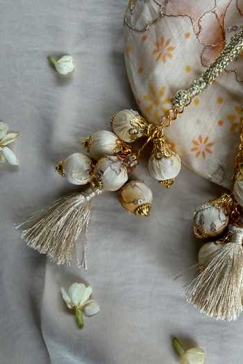 Quirky Tales_Peach Embroidery, Beads, Mirrors, Tassels Floral Work Strap Potli _Online_at_Aza_Fashions