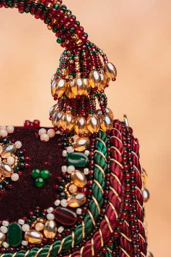 Nayaab By Sonia Maroon Empress Wine Charm Clutch Bag at Aza Fashions Nayaab By Sonia_Maroon Empress Wine Charm Clutch Bag _at_Aza_Fashions