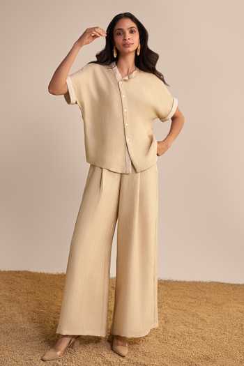 Dash And Dot_Beige Polyester Mandarin Collar Textured Asymmetric Shirt And Palazzo Set _at_Aza_Fashions