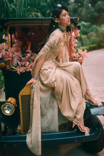 Paulmi And Harsh Peach Organza, Satin, Silk, Cotton Ottilie Printed Cape Draped Skirt Set at Aza Fashions Paulmi And Harsh_Peach Organza, Satin, Silk, Cotton Ottilie Printed Cape Draped Skirt Set _at_Aza_Fashions