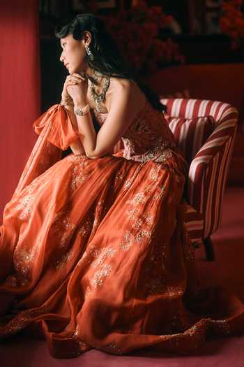 Shop Paulmi And Harsh Orange Net, Organza Embroidery Bandeau Neck Delilah Print Lehenga Corset Set Online at Aza Fashions Shop_Paulmi And Harsh_Orange Net, Organza Embroidery Bandeau Neck Delilah Print Lehenga Corset Set _Online_at_Aza_Fashions
