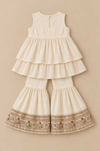 Buy MI Dulce An'Ya Ivory Cotton, Chanderi Embroidered Top And Layered Sharara Set Online at Aza Fashions Buy_MI Dulce An'Ya_Ivory Cotton, Chanderi Embroidered Top And Layered Sharara Set _Online_at_Aza_Fashions