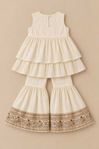 MI Dulce An'Ya Ivory Cotton, Chanderi Embroidered Top And Layered Sharara Set at Aza Fashions MI Dulce An'Ya_Ivory Cotton, Chanderi Embroidered Top And Layered Sharara Set _at_Aza_Fashions