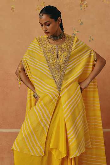 Shop_Pink City By Sarika_Yellow Silk Embroidery, Tassels V-neck Peela Leheriya Cape And Skirt Set _Online_at_Aza_Fashions