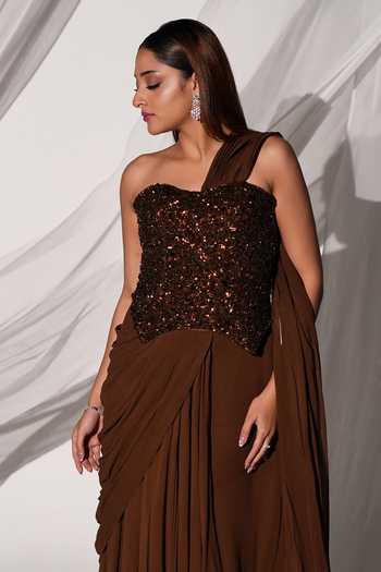 Shop Kiyohra Brown Georgette One Shoulder Ada Draped Embroidered Blouse With Skirt Saree Online at Aza Fashions Shop_Kiyohra_Brown Georgette One Shoulder Ada Draped Embroidered Blouse With Skirt Saree _Online_at_Aza_Fashions