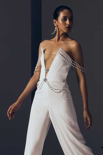 Tisharth By Shivani White Polyester Plunge Neck Pearl Jewelled Jumpsuit Online at Aza Fashions Tisharth By Shivani_White Polyester Plunge Neck Pearl Jewelled Jumpsuit _Online_at_Aza_Fashions