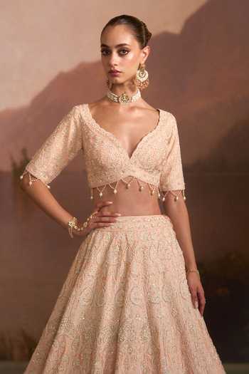 Angad Singh Peach Raw Silk Sweetheart Neck Pehli Kiran Lehenga Set at Aza Fashions Angad Singh_Peach Raw Silk Sweetheart Neck Pehli Kiran Lehenga Set _at_Aza_Fashions