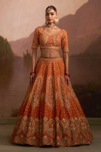 Angad Singh_Orange Raw Silk V-neck Angeethi Rust Lehenga Set _at_Aza_Fashions