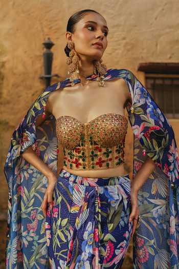 Shop Label Moni K Blue Silk, Net, Chinon Sweetheart Neck Fiorella Printed Cape Lehenga Set Online at Aza Fashions Shop_Label Moni K_Blue Silk, Net, Chinon Sweetheart Neck Fiorella Printed Cape Lehenga Set _Online_at_Aza_Fashions