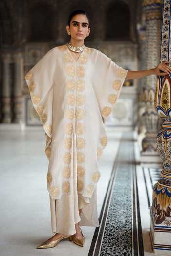 Dash And Dot White Viscose, Lurex V-neck Embroidered Kaftan Top And Brocade Draped Skirt Set at Aza Fashions Dash And Dot_White Viscose, Lurex V-neck Embroidered Kaftan Top And Brocade Draped Skirt Set _at_Aza_Fashions