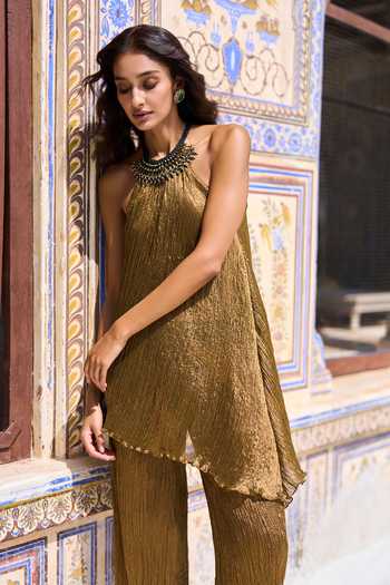 Dash And Dot Gold Viscose, Nylon Halter Neck Tribal Top And Pant Set at Aza Fashions Dash And Dot_Gold Viscose, Nylon Halter Neck Tribal Top And Pant Set _at_Aza_Fashions