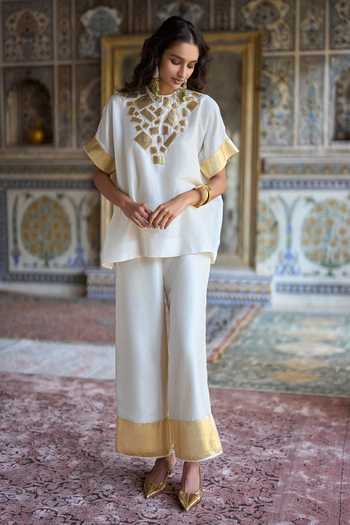 Dash And Dot Ivory Viscose Round Neck Gota Applique Boxy Top at Aza Fashions Dash And Dot_Ivory Viscose Round Neck Gota Applique Boxy Top _at_Aza_Fashions