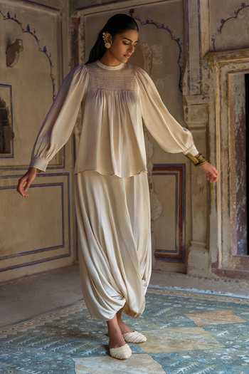 Dash And Dot White Polyester Round Neck Smocked Top And Cowl Draped Pant Set at Aza Fashions Dash And Dot_White Polyester Round Neck Smocked Top And Cowl Draped Pant Set _at_Aza_Fashions