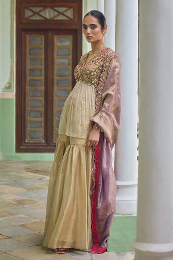 Buy Tamanna Punjabi Kapoor Gold Tissue V-neck Nazia Embroidered Kurta Gharara Set Online at Aza Fashions Buy_Tamanna Punjabi Kapoor_Gold Tissue V-neck Nazia Embroidered Kurta Gharara Set _Online_at_Aza_Fashions