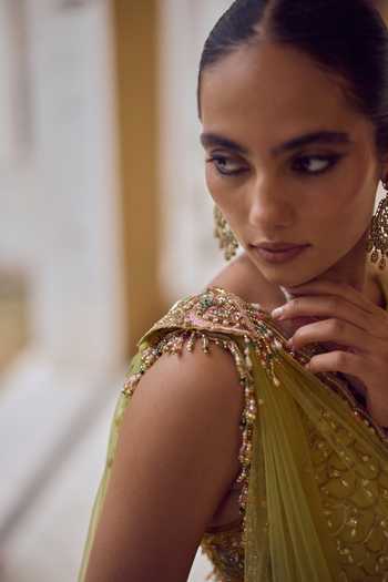 Tamanna Punjabi Kapoor Yellow Raw Silk, Net Halter Neck Sitaara Embroidered Lehenga Set Online at Aza Fashions Tamanna Punjabi Kapoor_Yellow Raw Silk, Net Halter Neck Sitaara Embroidered Lehenga Set _Online_at_Aza_Fashions