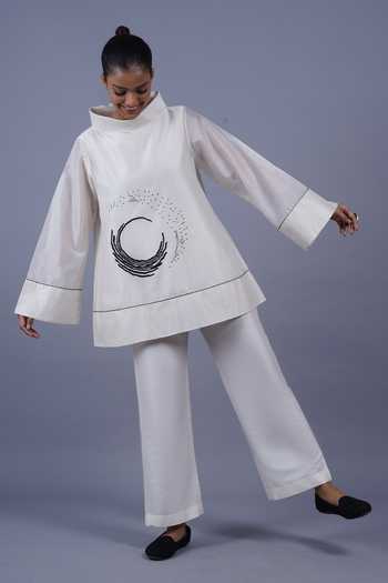 Taika By Poonam Bhagat Ivory Chanderi Mandarin Collar Crescent Placement Embroidered Top at Aza Fashions Taika By Poonam Bhagat_Ivory Chanderi Mandarin Collar Crescent Placement Embroidered Top _at_Aza_Fashions