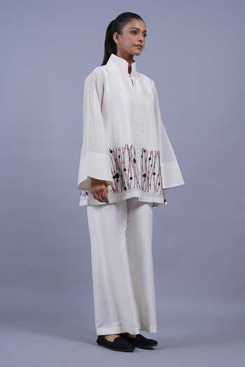 Taika By Poonam Bhagat_Ivory Chanderi Mandarin Collar Ribbons Border Embroidered Top _at_Aza_Fashions