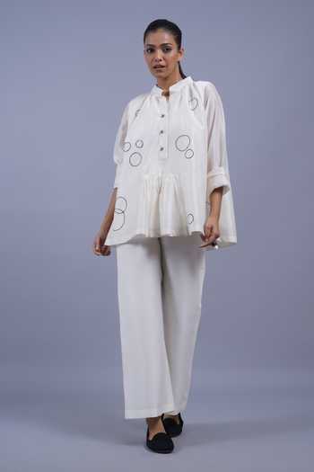 Taika By Poonam Bhagat Ivory Chanderi Mandarin Collar Discs Embroidered Short Top at Aza Fashions Taika By Poonam Bhagat_Ivory Chanderi Mandarin Collar Discs Embroidered Short Top _at_Aza_Fashions