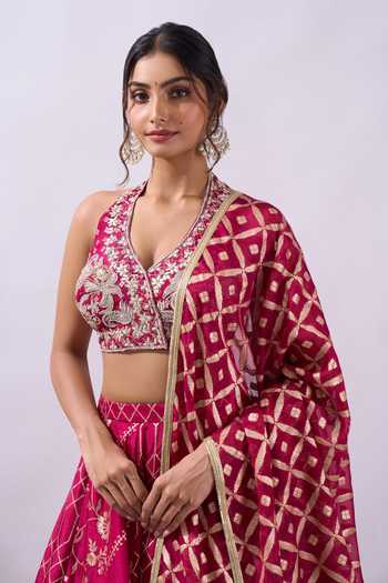 Azeera Fuchsia Brocade Halter Neck Woven Hand Embroidered Lehenga Set at Aza Fashions Azeera_Fuchsia Brocade Halter Neck Woven Hand Embroidered Lehenga Set _at_Aza_Fashions
