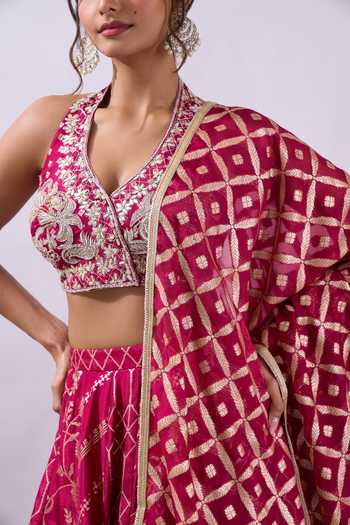 Shop Azeera Fuchsia Brocade Halter Neck Woven Hand Embroidered Lehenga Set Shop_Azeera_Fuchsia Brocade Halter Neck Woven Hand Embroidered Lehenga Set