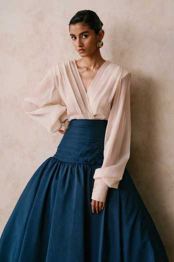 Shop Nirmooha Ivory Organza V-neck Equipoise Draped Blouse And Midi Skirt Set Online at Aza Fashions Shop_Nirmooha_Ivory Organza V-neck Equipoise Draped Blouse And Midi Skirt Set _Online_at_Aza_Fashions