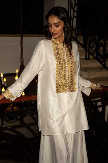 Buy Dash And Dot Ivory Viscose, Nylon Band Metallic Thread Embroidered Top And Draped Culottes Set Online at Aza Fashions Buy_Dash And Dot_Ivory Viscose, Nylon Band Metallic Thread Embroidered Top And Draped Culottes Set _Online_at_Aza_Fashions
