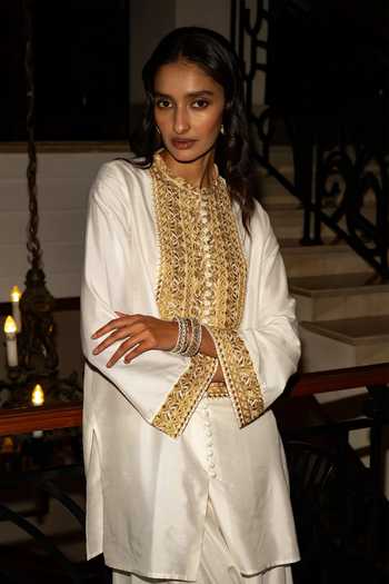 Shop Dash And Dot Ivory Viscose, Nylon Band Metallic Thread Embroidered Top And Draped Culottes Set Online at Aza Fashions Shop_Dash And Dot_Ivory Viscose, Nylon Band Metallic Thread Embroidered Top And Draped Culottes Set _Online_at_Aza_Fashions