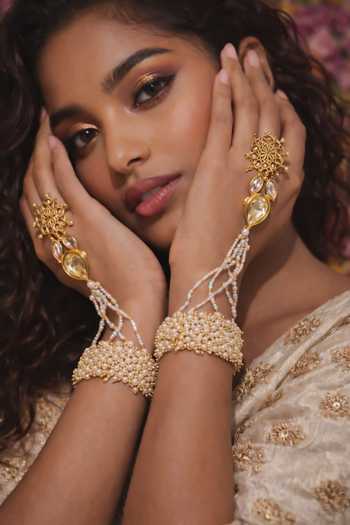 Buy Ornamaas White Jhalar Accents Pearl Hathphool - Single Pc Online at Aza Fashions Buy_Ornamaas_White Jhalar Accents Pearl Hathphool - Single Pc _Online_at_Aza_Fashions