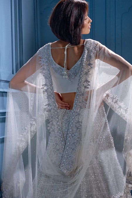 Shop Angad Singh White Net Interlining Satin V Neck Embroidered Cape And Lehenga Set Online at Aza Fashions Shop_Angad Singh_White Net Interlining Satin V Neck Embroidered Cape And Lehenga Set _Online_at_Aza_Fashions