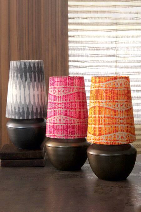 Shop Courtyard Orange Metal Abstract Pattern Shubha Circular Table Light at Aza Fashions Shop_Courtyard_Orange Metal Abstract Pattern Shubha Circular Table Light_at_Aza_Fashions