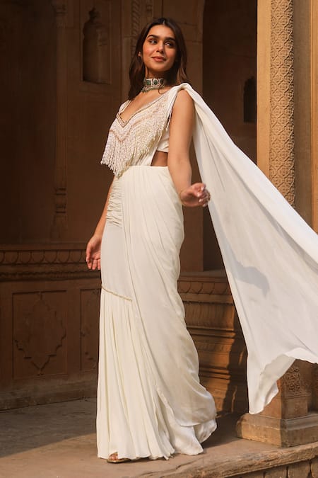 Shop Dheeru Taneja Ivory Crepe, Chiffon Pearls Maryam Pre-draped Saree With Tassel Blouse at Aza Fashions Shop_Dheeru Taneja_Ivory Crepe, Chiffon Pearls Maryam Pre-draped Saree With Tassel Blouse _at_Aza_Fashions