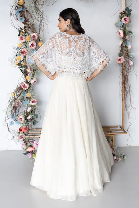 Sunita Bhandari Ivory Net, Viscose Pearls, Feathers, Sequins Embroidered Cape Lehenga Set Online at Aza Fashions Sunita Bhandari_Ivory Net, Viscose Pearls, Feathers, Sequins Embroidered Cape Lehenga Set _Online_at_Aza_Fashions