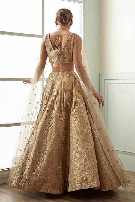 Shop Studio Iris India Gold Organza, Net Cut Work, Stones Cape Sleeve Embroidered Blouse And Lehenga Set at Aza Fashions Shop_Studio Iris India_Gold Organza, Net Cut Work, Stones Cape Sleeve Embroidered Blouse And Lehenga Set_at_Aza_Fashions