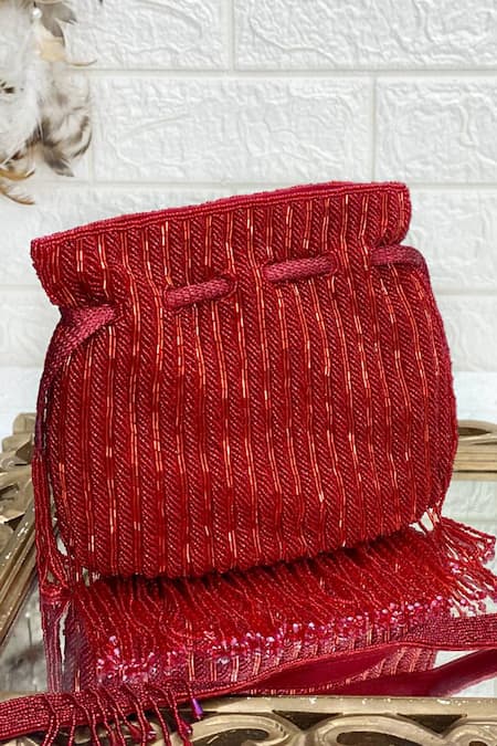 Shop Kainiche By Mehak Red Embellished Tassel Fringe Border Potli at Aza Fashions Shop_Kainiche By Mehak_Red Embellished Tassel Fringe Border Potli _at_Aza_Fashions