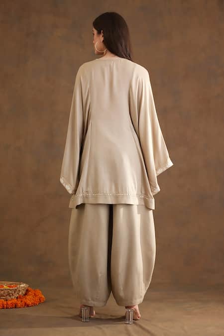 Shop Nikasha Beige Rayon Beads, Embroidery V-neck Yoke Kaftan Top And Baggy Pant Set at Aza Fashions Shop_Nikasha_Beige Rayon Beads, Embroidery V-neck Yoke Kaftan Top And Baggy Pant Set _at_Aza_Fashions