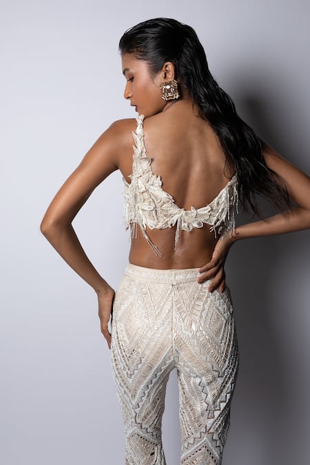 Shop Ritika Mirchandani Ivory Net Embroidery Floral Plunge Hazel Applique Bustier And Pant Set at Aza Fashions Shop_Ritika Mirchandani_Ivory Net Embroidery Floral Plunge Hazel Applique Bustier And Pant Set _at_Aza_Fashions