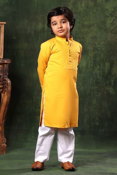 Shop Littlecheer Yellow Cotton Satin Pintuck Kurta And White Pyjama Set at Aza Fashions Shop_Littlecheer_Yellow Cotton Satin Pintuck Kurta And White Pyjama Set _at_Aza_Fashions