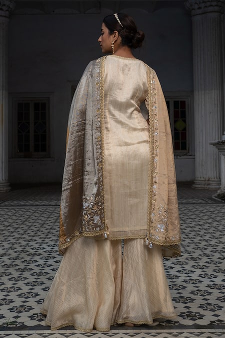 Shop Sheela Suthar Ivory Chanderi, Tissue Zari, Diamonds V-neck Stripe Pattern Kurta Gharara Set at Aza Fashions Shop_Sheela Suthar_Ivory Chanderi, Tissue Zari, Diamonds V-neck Stripe Pattern Kurta Gharara Set _at_Aza_Fashions