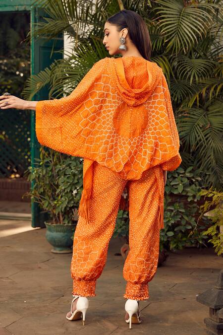 Shop Twenty Nine Orange Crepe Fringe V-neck Crushed Bandhani Hoodie at Aza Fashions Shop_Twenty Nine_Orange Crepe Fringe V-neck Crushed Bandhani Hoodie _at_Aza_Fashions