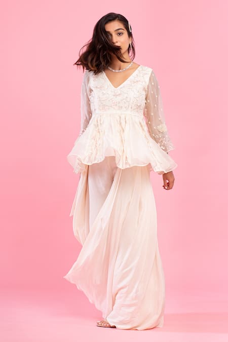 Shop PIRI INDIA Ivory Organza, Crepe Embroidery V-neck Hand Peplum And Palazzo Set at Aza Fashions Shop_PIRI INDIA_Ivory Organza, Crepe Embroidery V-neck Hand Peplum And Palazzo Set _at_Aza_Fashions