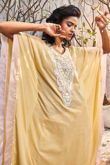 Shop Charkhee Yellow Cotton Beads, Cut Work V-neck Stripe Pattern Embellished Kaftan at Aza Fashions Shop_Charkhee_Yellow Cotton Beads, Cut Work V-neck Stripe Pattern Embellished Kaftan_at_Aza_Fashions