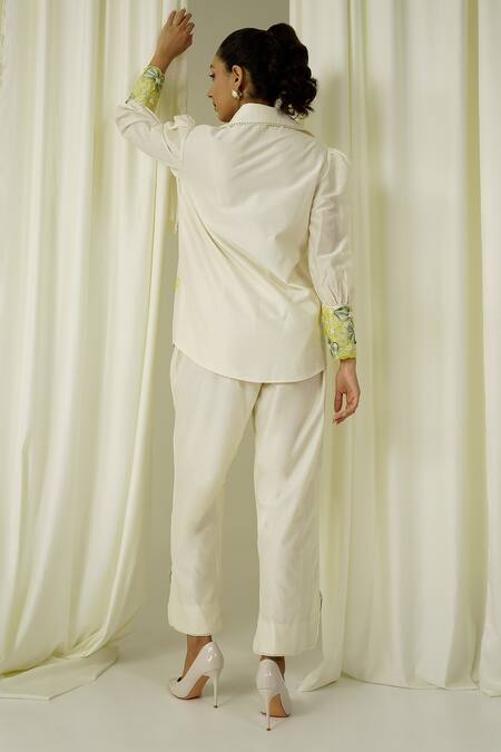 Shop Sakshi Khetterpal Ivory Chanderi Pearls, Beads, Embroidery Collared Shirt And Pant Set at Aza Fashions Shop_Sakshi Khetterpal_Ivory Chanderi Pearls, Beads, Embroidery Collared Shirt And Pant Set _at_Aza_Fashions